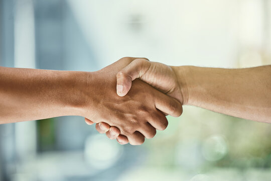 Business people, handshake and partnership with team in greeting, agreement or deal at office. Closeup of employees shaking hands for introduction, b2b or welcome in hiring, collabration or workplace