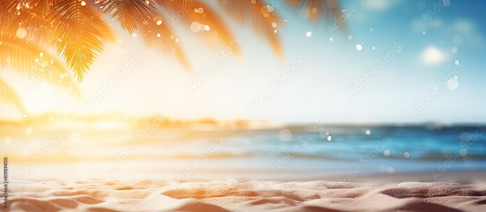 Poster Abstract background with a blurred tropical beach and bokeh sunlight waves providing ample copy space for an image