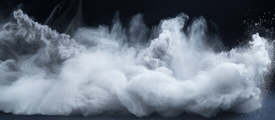 In this copy space image a dynamic burst of white powder is frozen in motion creating an abstract and captivating background