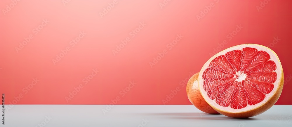 Aufkleber A vibrant background complementing a fresh grapefruit slice leaving room for copy space in the image