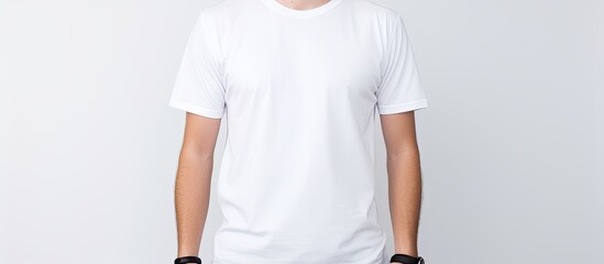 Front view of a man wearing a clean white and black t shirt standing alone against a white background Perfect for use as a copy space image