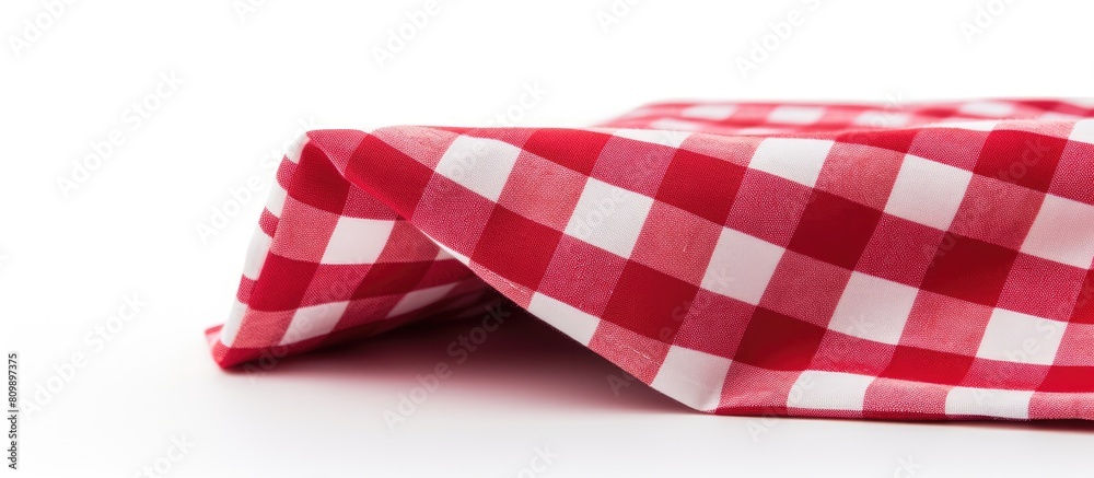 Fototapete a checkered textile napkin is displayed on a white background leaving ample copy space in the image