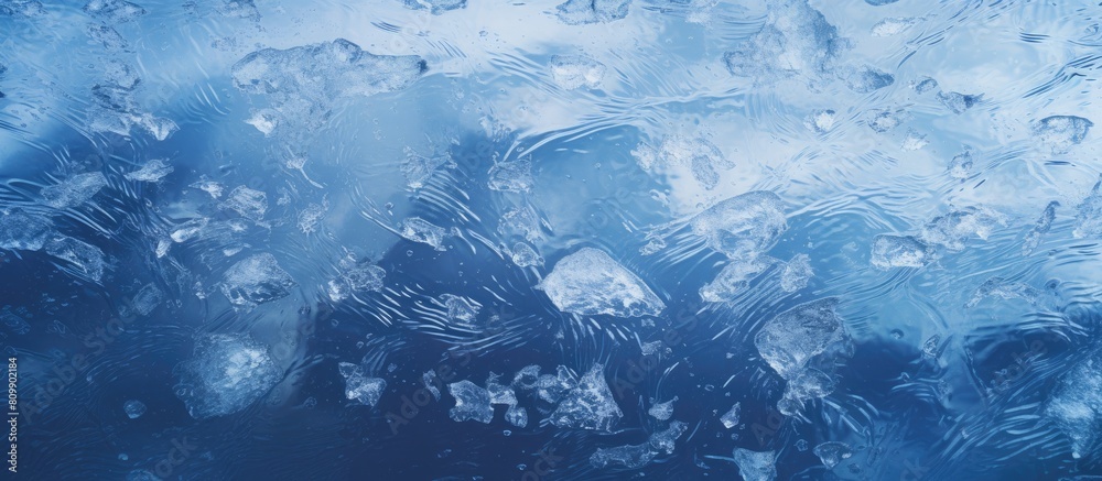 Poster Close up of a frozen river with cracked ice covered in white snow and revealing the deep blue water underneath This copy space image showcases the texture of the ice