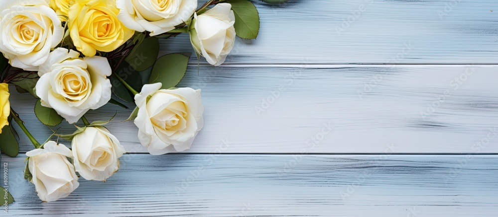 Aufkleber a white and yellow rose arrangement is beautifully displayed on a rustic blue wooden background crea