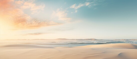 A peaceful and relaxing summer concept of a desert beach at sunset with a white sandy background and ample copy space for your image