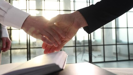 A handshake after a successful business transaction