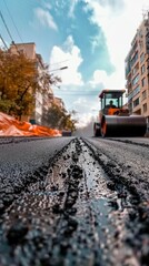 Laying fresh asphalt, road work with asphalt finisher , asphalt paver rolls asphalt
