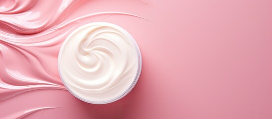 A close up view of a trendy skincare product presented in a white cream jar on a pink background The image features a dry flower adding to the beauty cosmetics presentation The top view offers a tren - Powered by Adobe
