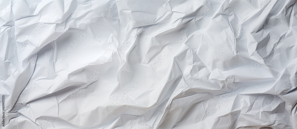 Poster A crumpled paper surface ideal for adding texture to backgrounds and designs captured in an abstract copy space image