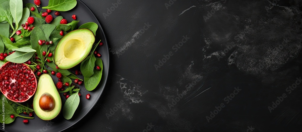 Poster top view of a visually appealing avocado salad featuring baby spinach and pomegranate presented on a