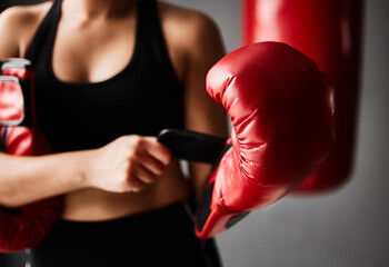 Gloves, ready or hands of woman in boxing training, exercise or workout in gym studio for wellness....