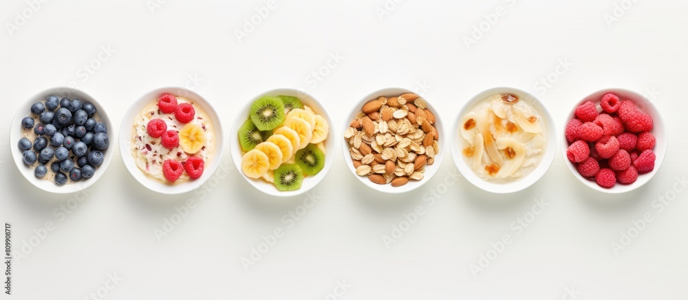 Poster overhead shot of a selection of cold cereals served in white bowls offering a convenient and quick b