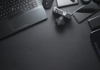 Modern black gadgets and accessories. Laptop, camera, smartphone, stere, external hard drive, USB...