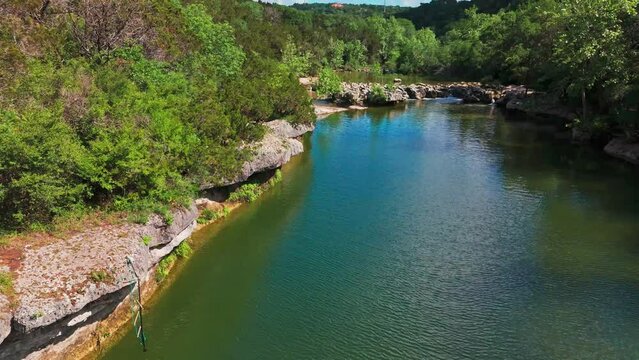 Scenic aerial view of Sculpture Falls via Barton Creek Greenbelt Trail in Austin Texas at summer