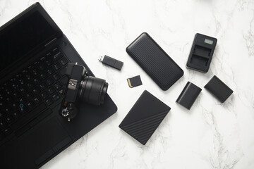 Modern photographer equipment, gadgets and accessories of on marble background. Flat lay