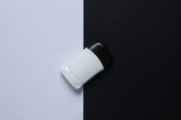 Antiperspirant tube on black white background. Sweat protection. Top view