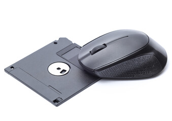 PC mouse with floppy disk on white background