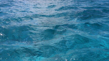 Pristine crystal clear turquoise blue sea water of th Caribbean Atlantic ocean flowing with waves 