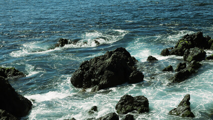 Abstract background. Waves of sea water meet underwater rocks, whirlpool