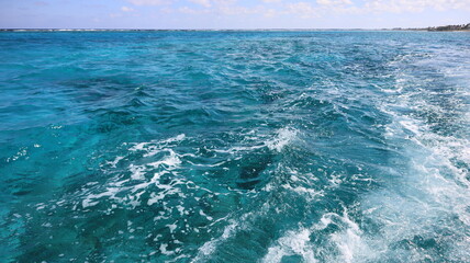 Grand Cayman, Cayman Islands blue sky and blue Pristine crystal clear turquoise blue sea water of...