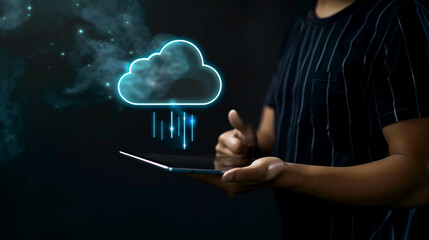 Person holding a tablet with a glowing cloud symbol above it, representing hand thumbs up sign on a dark background