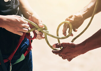 Rock climbing, nature and hands of people with rope for training, exercise and outdoor extreme...