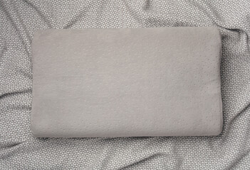 Gray orthopedic pillow on a blanket. Healthy sleep