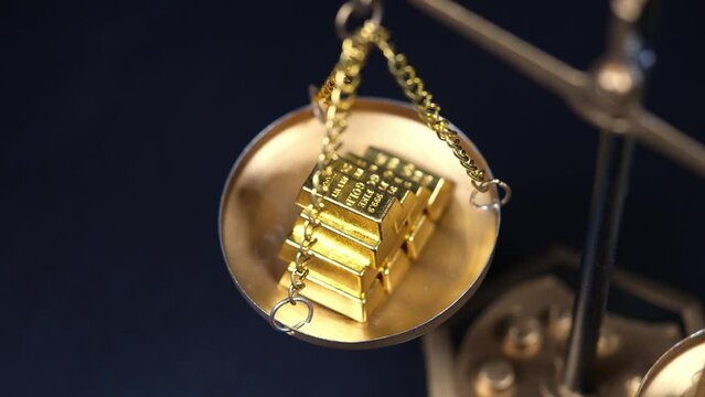 Gold price and value in both arms scales