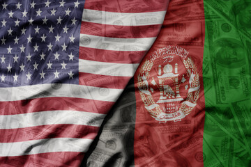 big waving colorful flag of united states of america and national flag of afghanistan on the dollar...