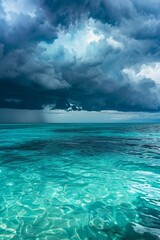 Obraz premium A storm brewing over the ocean, dark clouds contrasting with turquoise water, panoramic format