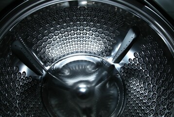 Empty washing machine drum, closeup view. Laundry day