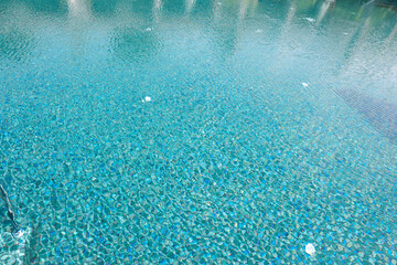 Clear water with ripples in swimming pool outdoors