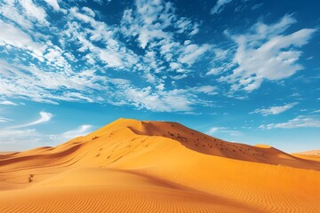 Fototapeta na wymiar landscape of golden sand dune with blue sky in Sahara deserts