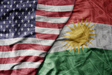 big waving colorful flag of united states of america and national flag of kurdistan on the dollar...