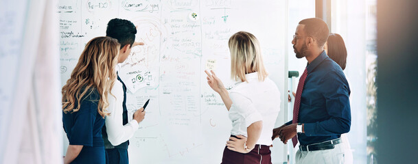 Business people, teamwork and brainstorming idea at whiteboard or problem solving, creative or...