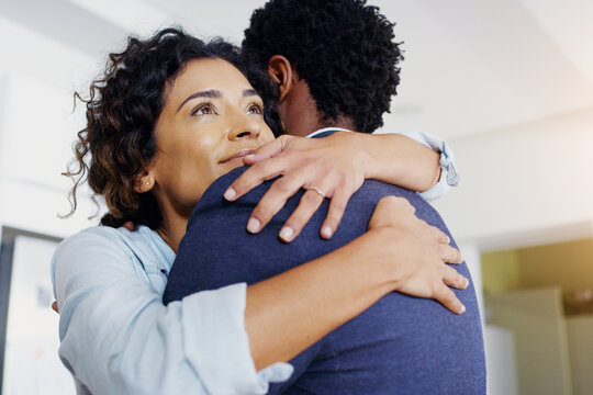 Couple, hug and care in home with love, smile and connection for reunion, bonding and thinking. African woman, man and partner with embrace, happy and security in relationship for trust in marriage
