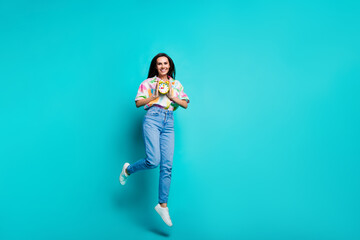 Photo of nice positive crazy woman dressed stylish print shirt hold watch clock isolated on cyan color background