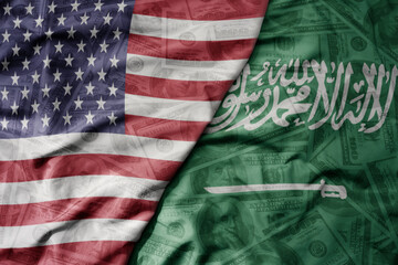 Obraz premium big waving colorful flag of united states of america and national flag of saudi arabia on the dollar money background. finance concept.