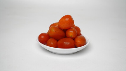 Red cherry tomatoes isolated on white background
