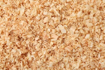 Pile of natural sawdust as background, top view