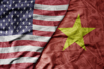 Obraz premium big waving colorful flag of united states of america and national flag of vietnam on the dollar money background. finance concept.
