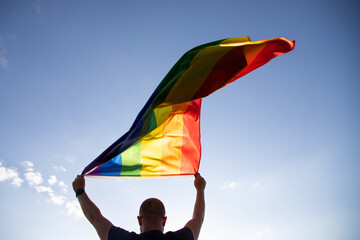 Young man with LGBT flag.