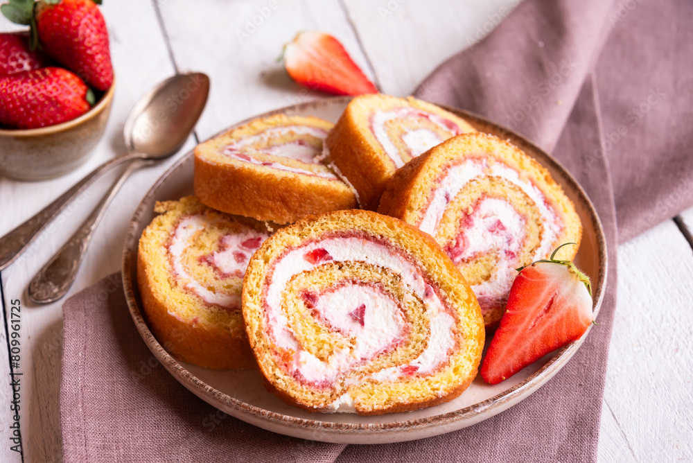 Wall mural Swiss roll with strawberries and cream, homemde dessert