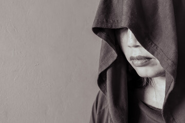 Profile of a Asian Hooded Woman in Black and White