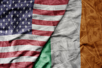 Obraz premium big waving colorful flag of united states of america and national flag of ireland on the dollar money background. finance concept.