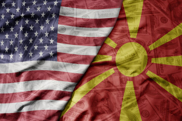 Obraz premium big waving colorful flag of united states of america and national flag of macedonia on the dollar money background. finance concept.