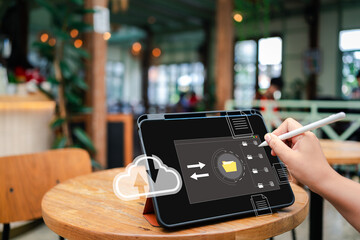 Hands touching a tablet screen displaying a virtual cloud-based document management system for...