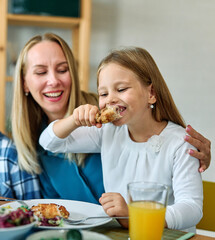 child family lunch food meal eating mother dinner father together happy daughter son boy girl home...
