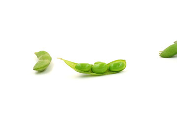 Fresh edamame soybeans and pods isolated on white background.