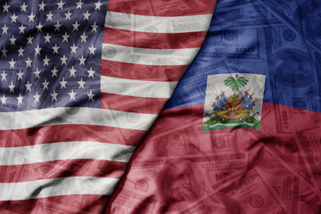 big waving colorful flag of united states of america and national flag of haiti on the dollar money background. finance concept. - obrazy, fototapety, plakaty